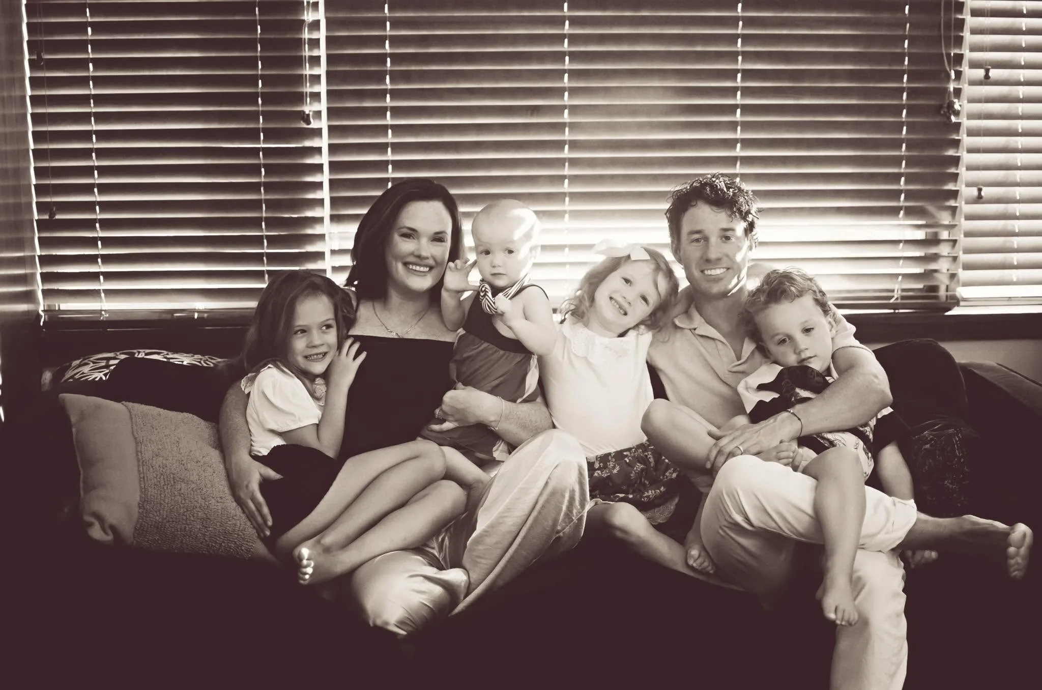 Kelsey Seaman at home with her husband and their four children.